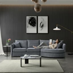 A lady lying on a chaise sofa and reading