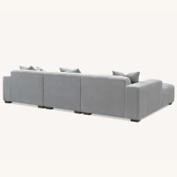 corner sofa in cloudy grey back view