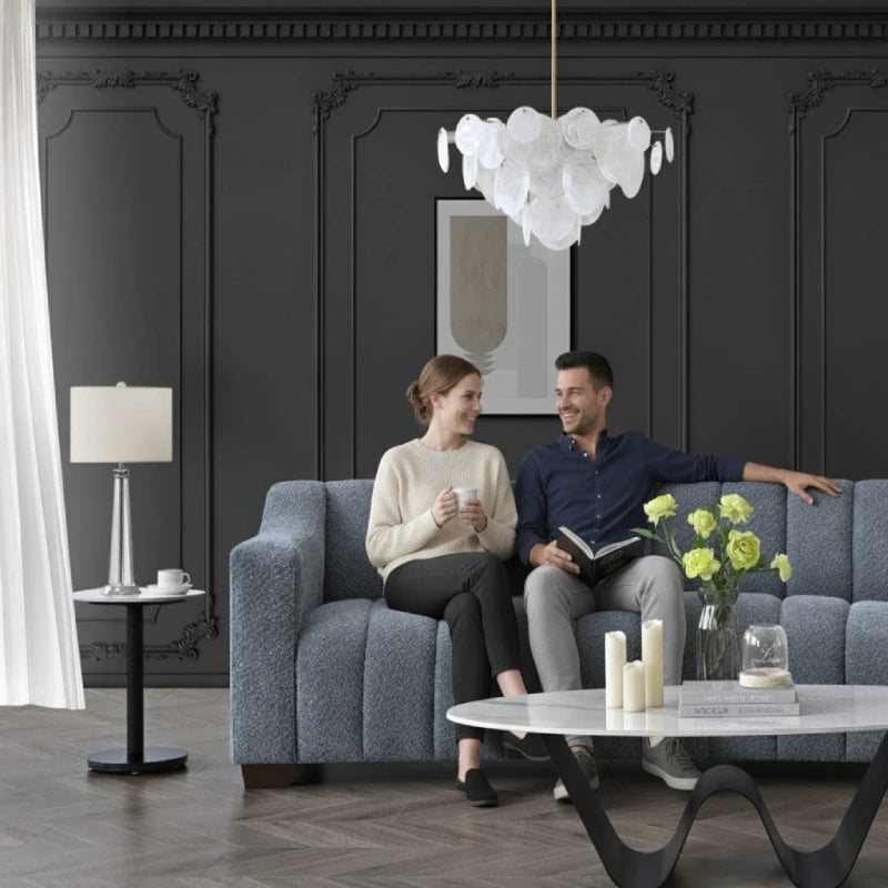 a couple sitting on a sofa and having a good time