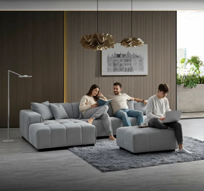 family in a living room and their grey corner sofa