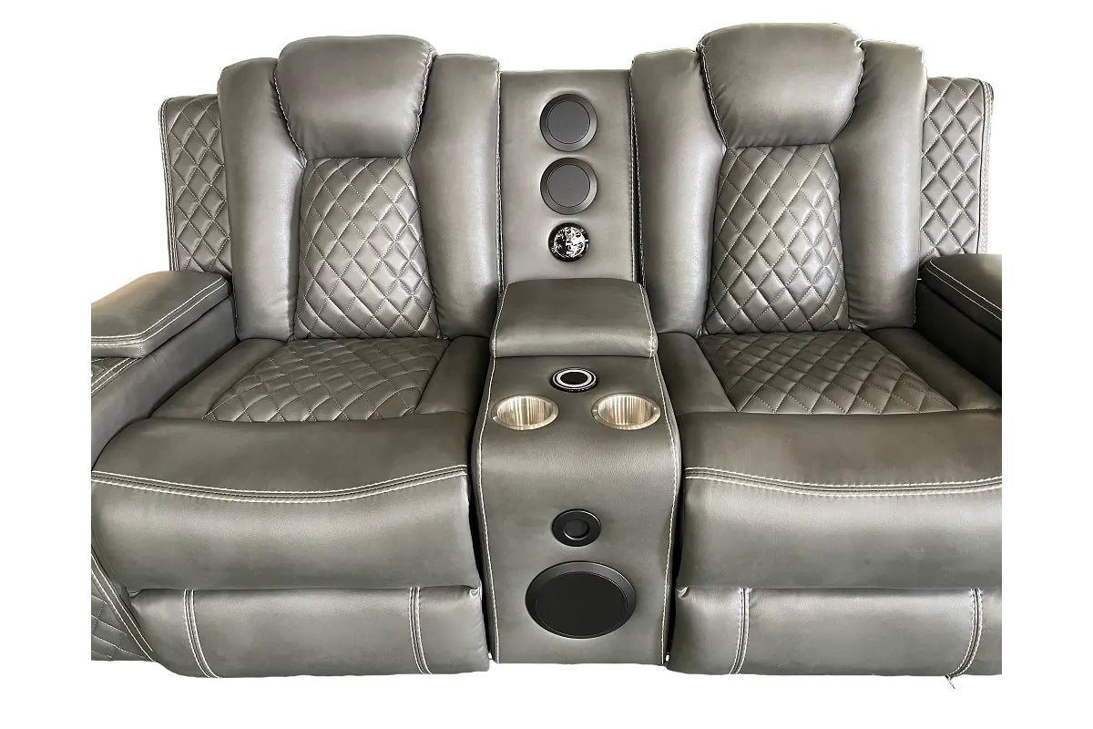 grey reclining sofa with speaker