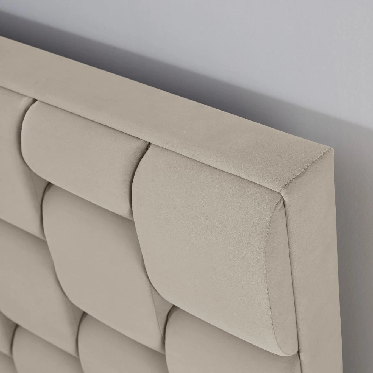 cream bed ottoman showing headboard