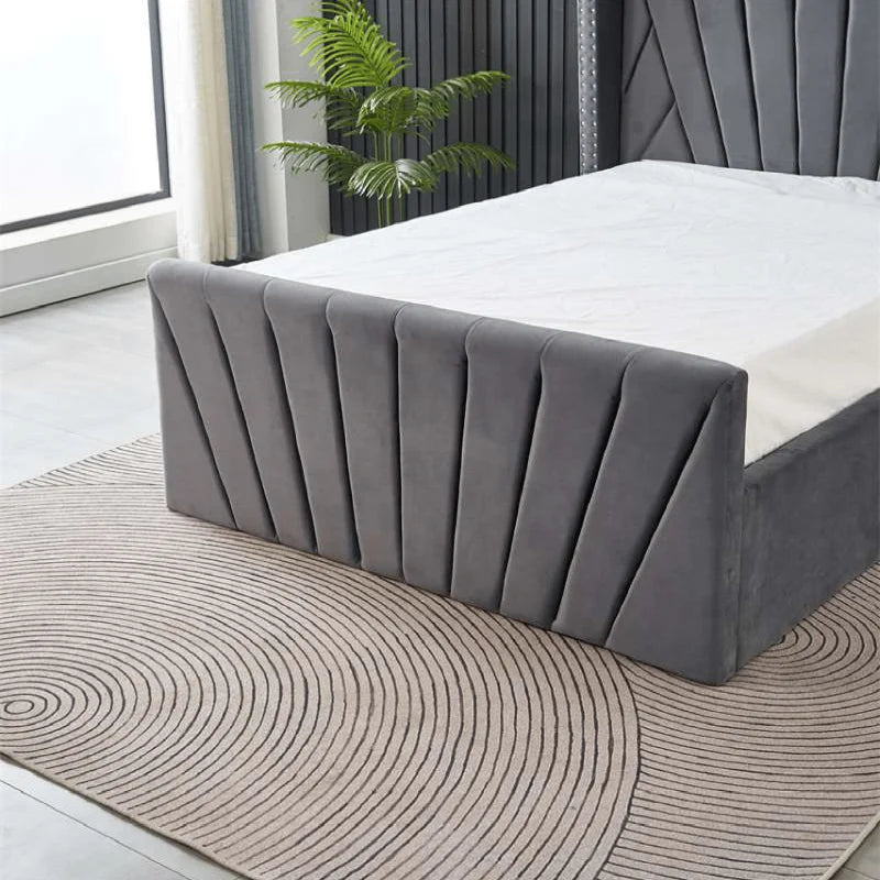 ottoman winged bed with studded headboard